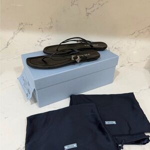 Prada Black Thong Sandals with Silver Logo Charm